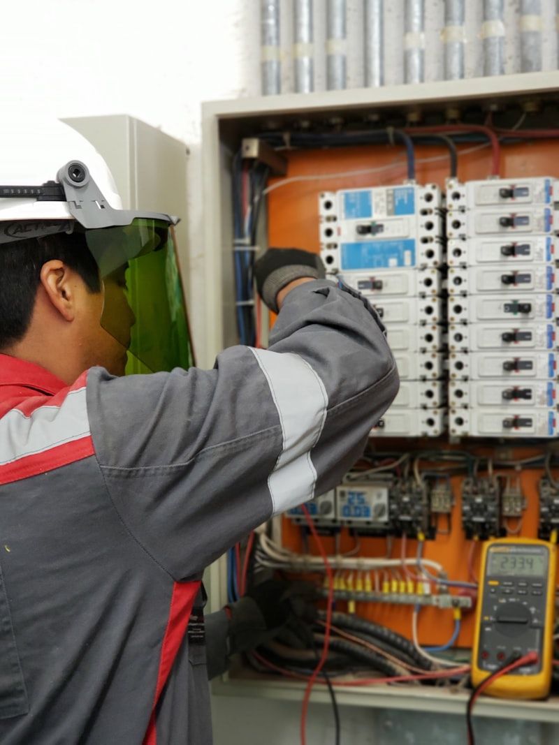 Electrician testing a distribution board
