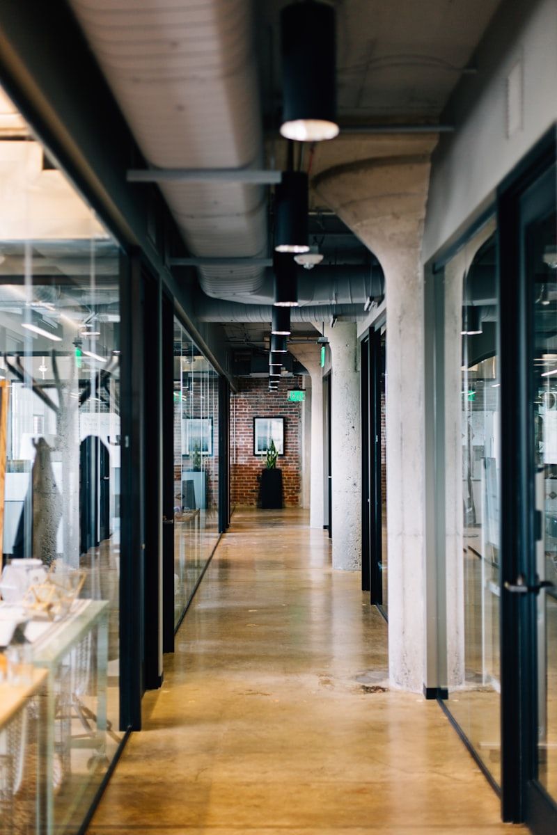 Fitted-out commercial office with glazed partitions and exposed services